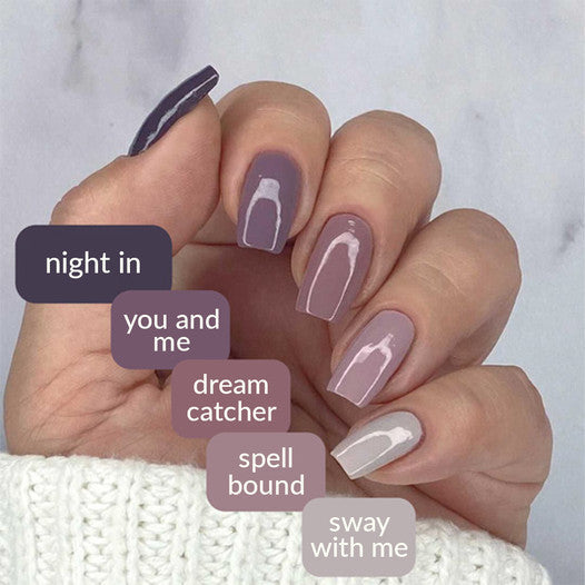 Mauve Skittle manicure with each nail a different mauve shade, labeled with shade names