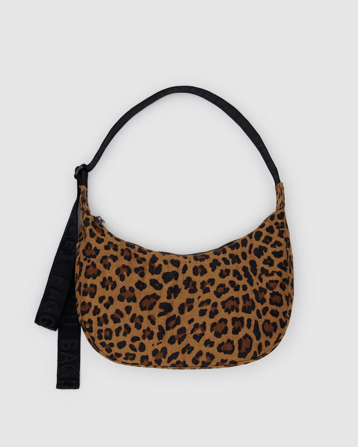 Leopard print nylon crescent bag with black strap and hanging tag