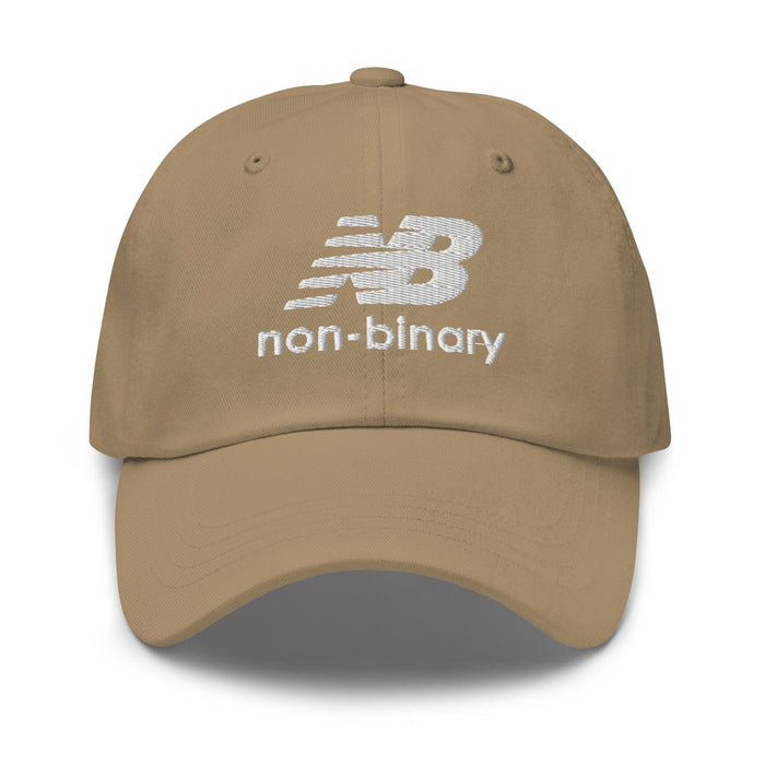 A khaki baseball cap featuring a white embroidered 'non-binary' logo on the front, set against a plain white background.