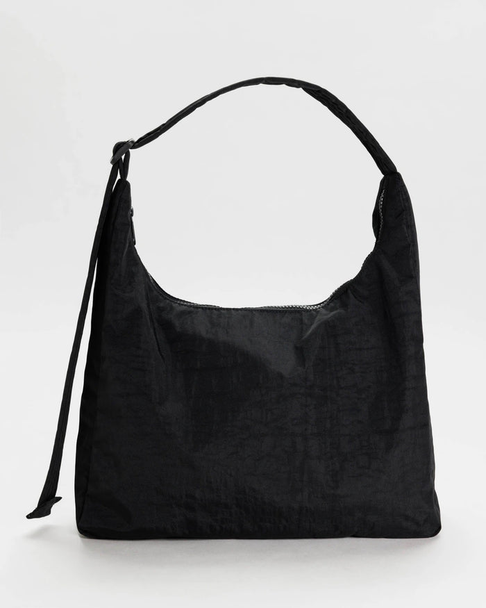 Black nylon shoulder bag with curved top handles and front pocket seam