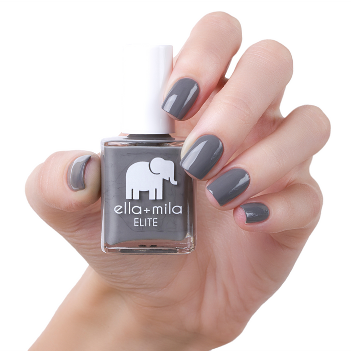 On the Runway soft dark grey nail polish manicure on a light skin tone with the bottle
