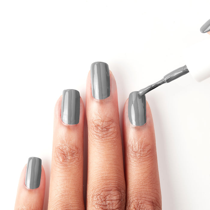 Applying On the Runway dark grey nail polish