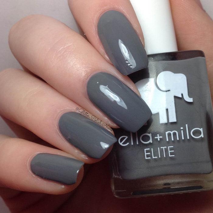 On the Runway soft dark grey nail polish close-up with the bottle