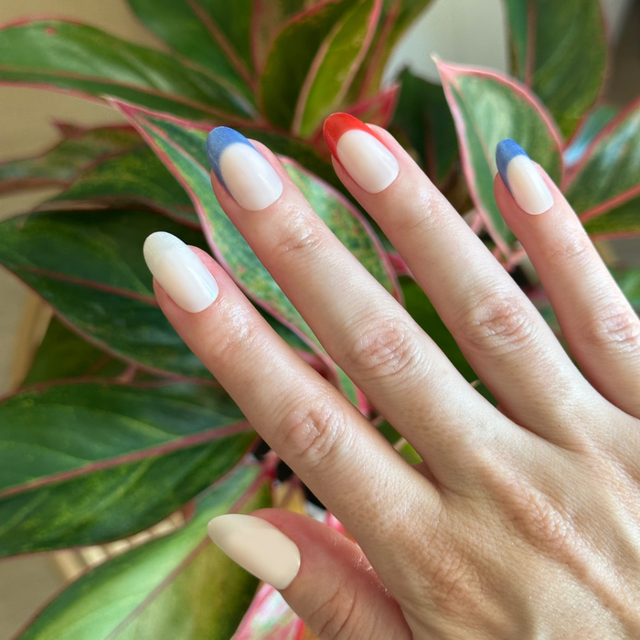 Parade Velvet French - Press-On | Medium | Oval with sheer milky base and velvet red and blue French tip manicure