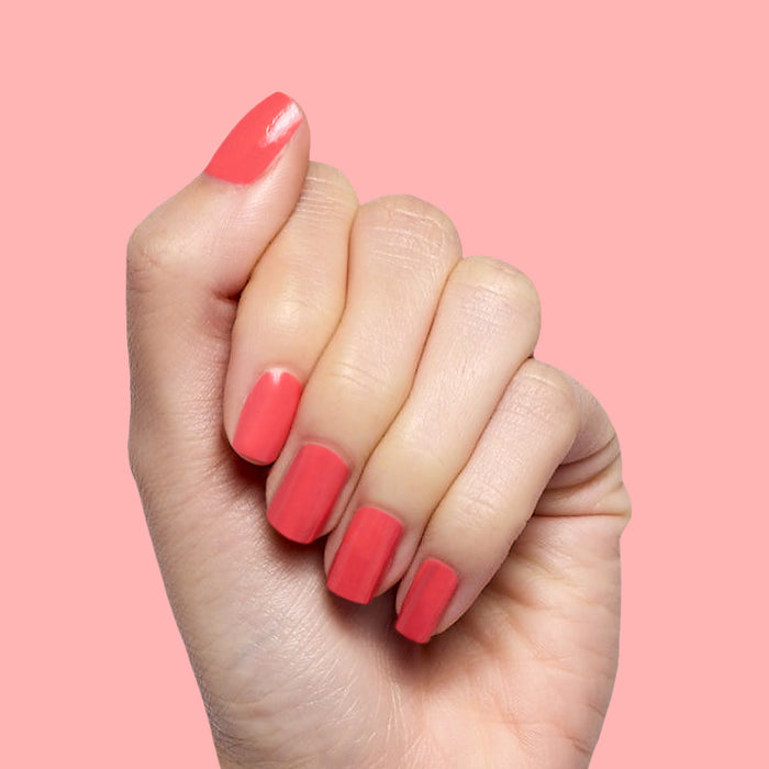 Perfect Pinwheel coral gel polish on natural nails with a smooth glossy finish for a cheerful at-home mani