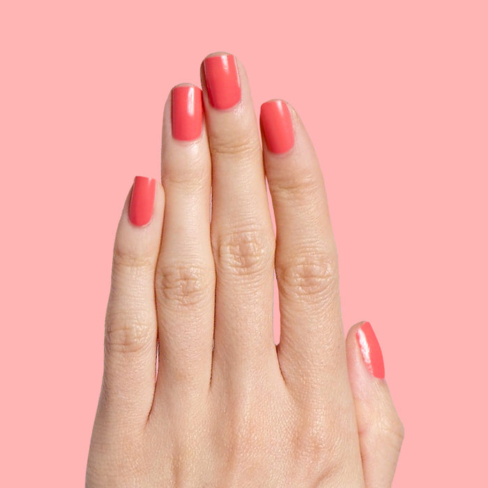 Perfect Pinwheel coral gel polish on natural nails with a smooth glossy finish for a cheerful manicure at home