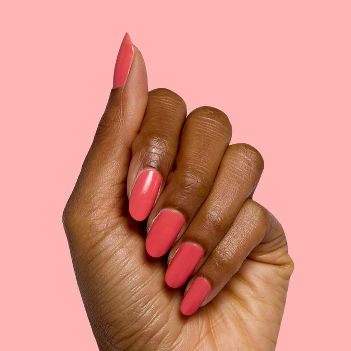 Perfect Pinwheel coral gel polish on natural nails with a smooth, glossy finish for a cheerful at-home manicure