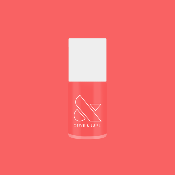 Perfect Pinwheel coral gel polish bottle by Olive and June for long-lasting at home manicures with a vibrant finish