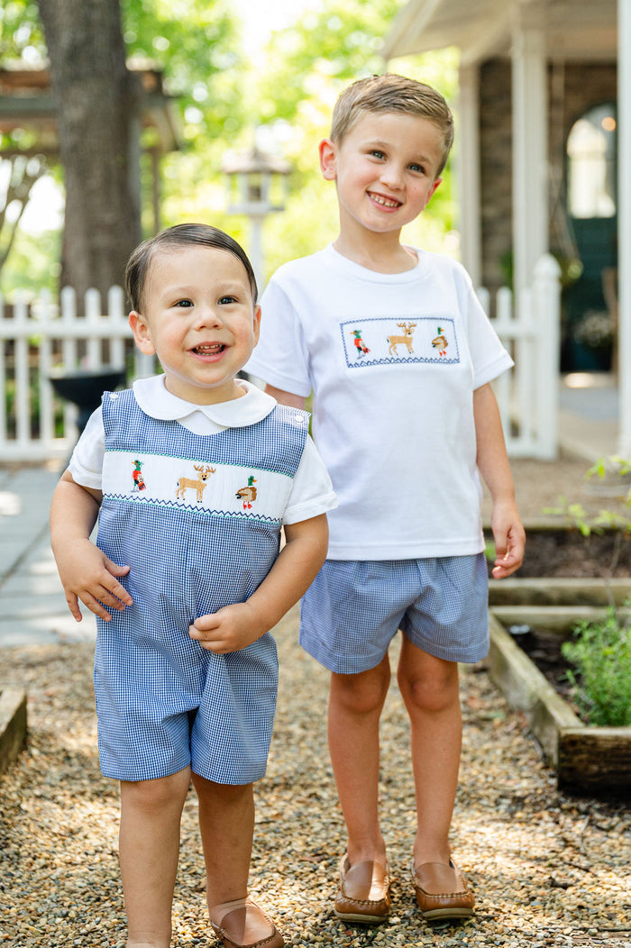 Close-up of two boys outdoors in matching Ruth and Ralph smocked hunting outfits