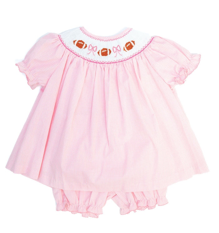 Smocked Pink Football Bloomer Set in pink gingham with a hand-smocked neckline of footballs and bows and coordinating diaper cover
