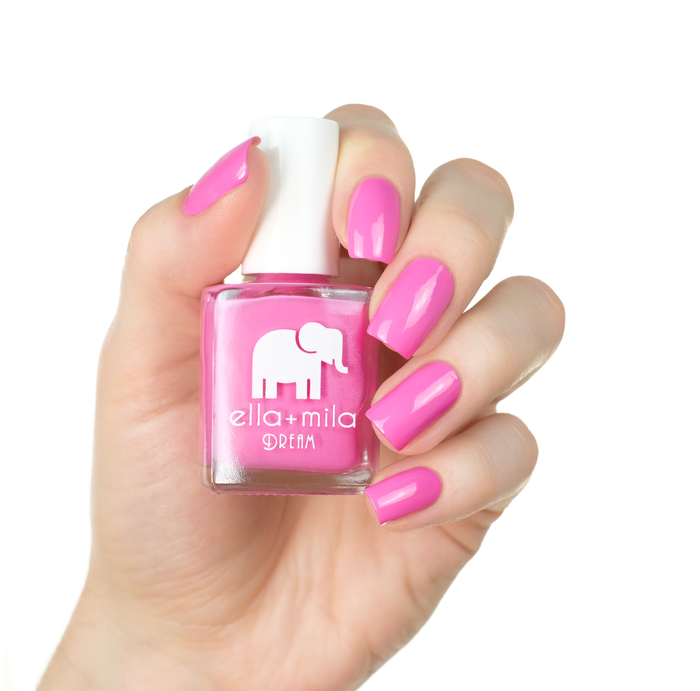 Pinkterest+ bubblegum pink nail polish manicure on a light skin tone with the bottle