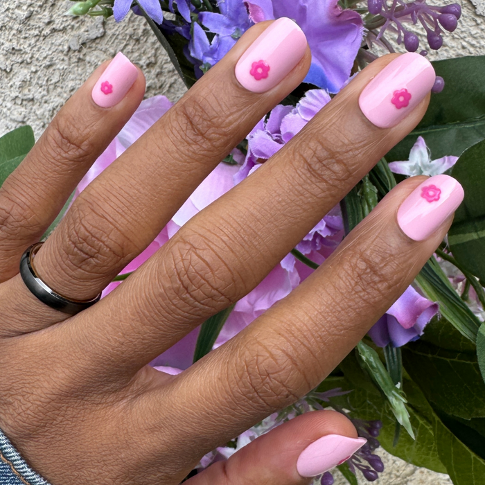 Puffy Daisy - Press-On | Short | Squoval showing short squoval false nails with pink base and small raised hot pink flower decor on hand