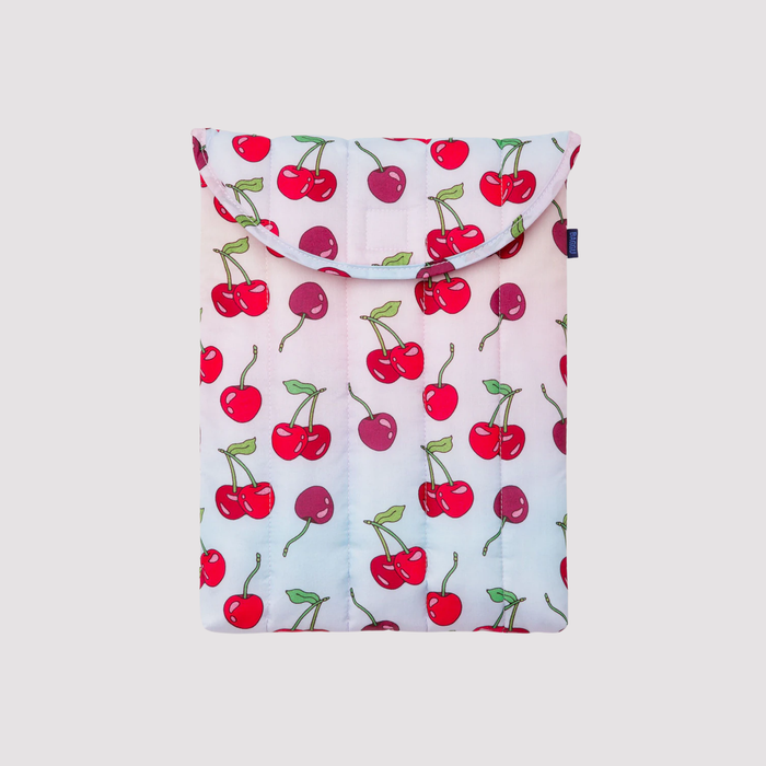 White puffy 13"/14" laptop sleeve with red cherry pattern and top flap.