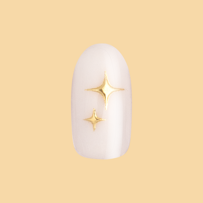 Puffy Sparkle - Press-On | Medium | Oval showing single medium oval false nail with white base and raised gold sparkle design