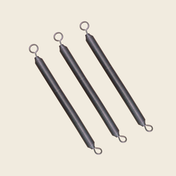 Set of three coiled push thru bar springs with looped ends for Cadillac apparatus.