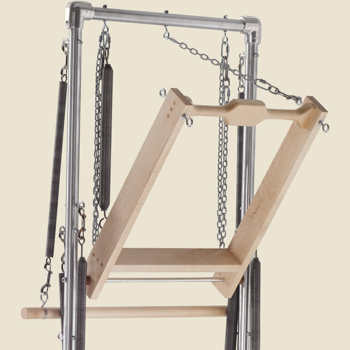 Push thru bar springs attached to a wooden Cadillac push-through bar with chains.