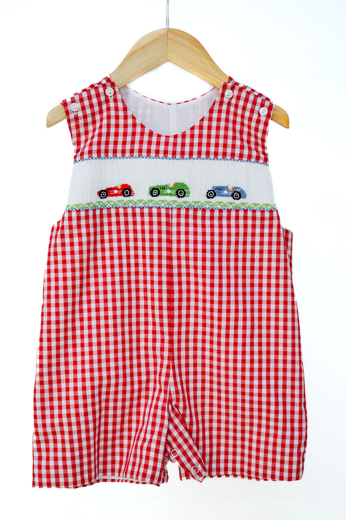 Smocked Race Car Jon Jon by Ruth and Ralph, red gingham with smocked race car embroidery, on hanger