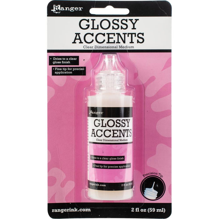 RANGER-Ink Essentials Glossy Accents. An acid free, 3-D, clear gloss medium. Use to brighten, add dimensions and magnify. Place under embellishments to make them stick. Also place on top of embellishments to protect and add a glossy overlay. This package contains 2 ounces in a bottle with a precision tip. Made in USA. Available at Embellish Away located in Bowmanville Ontario Canada.