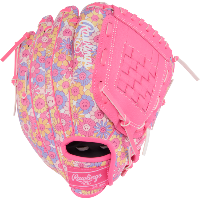 A Rawlings Players Series 10″ Youth Fastpitch Glove (PL10P) by Rawlings is shown from an angled side view, featuring a pink design with a floral pattern of yellow, white, and pink flowers alongside button shapes. This 10-inch glove is ideal for young players seeking both style and performance on the field.