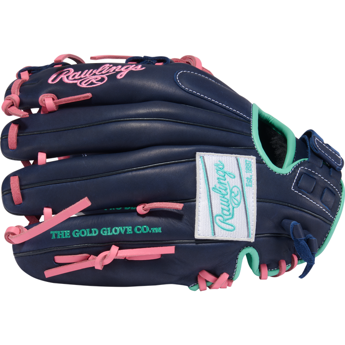 The Rawlings R9 11.5" Fastpitch Glove (R9SB115U-2N) is navy blue with pink laces, teal accents, and white patches showing the Rawlings logo and “The Gold Glove Co.” text in green. The glove's outer side is visible.