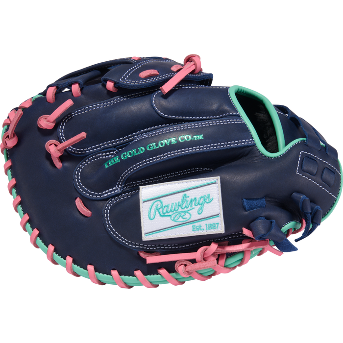 The Rawlings R9 33" Fastpitch Catcher's Mitt (R9SBCM33-24NMP) features blue leather, pink laces, mint green accents, and teal Rawlings/The Gold Glove Co. embroidery—a standout mitt perfect for softball catchers.