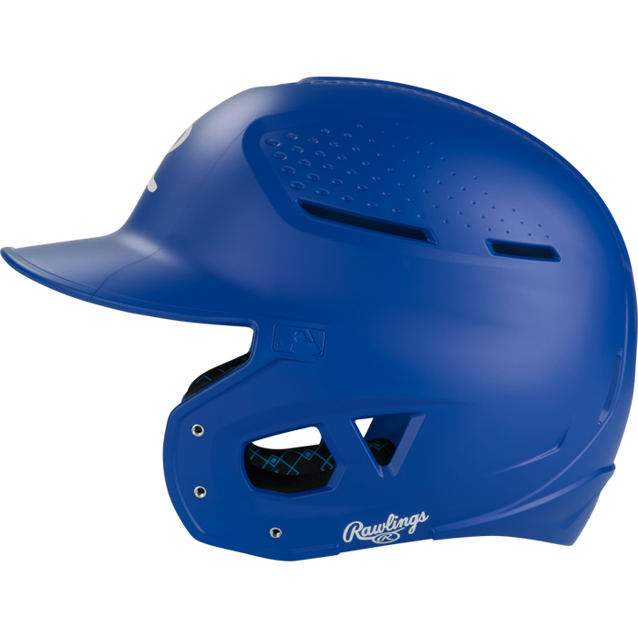 The Rawlings RX2 Matte Batting Helmet (RX2MAT) is shown in blue with vented holes, a faceguard, and the Rawlings logo near the ear—viewed from the side on a white background. Ideal as a youth batting helmet.