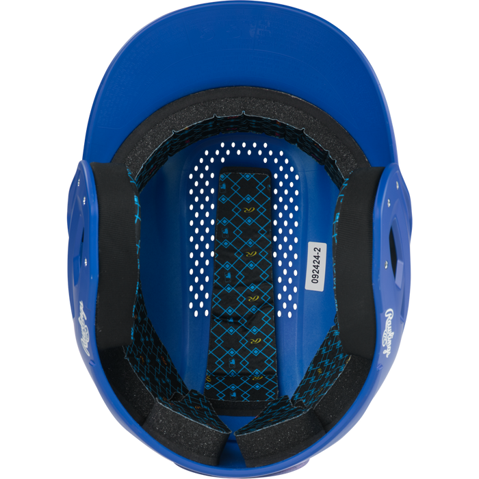 A top-down view of the inside of a blue Rawlings RX2 Matte Batting Helmet: RX2MAT, showing black foam padding, ventilation holes, and a patterned inner lining with a sticker labeled 089242.