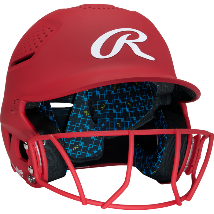 A Rawlings RX2 Matte Batting Helmet with Fastpitch Mask (RX2SBMAT) features a red shell, softball face guard, and blue padded interior with a geometric pattern and small R logos.