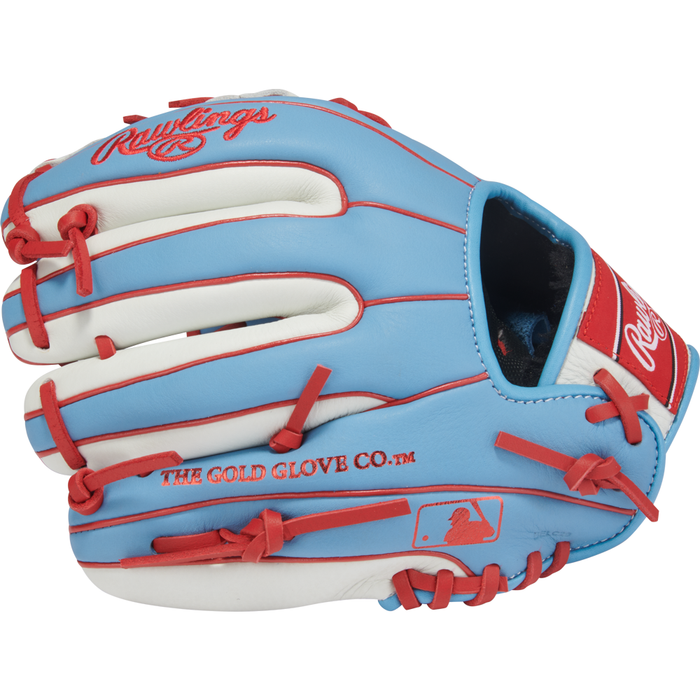 A youth baseball glove inspired by Carlos Correa, the Rawlings Select Pro Lite 10.5″ (SPL105CCCB), features a blue, white, and red design with red laces, The Gold Glove Co. script, and an MLB logo on the side—perfect for young players.