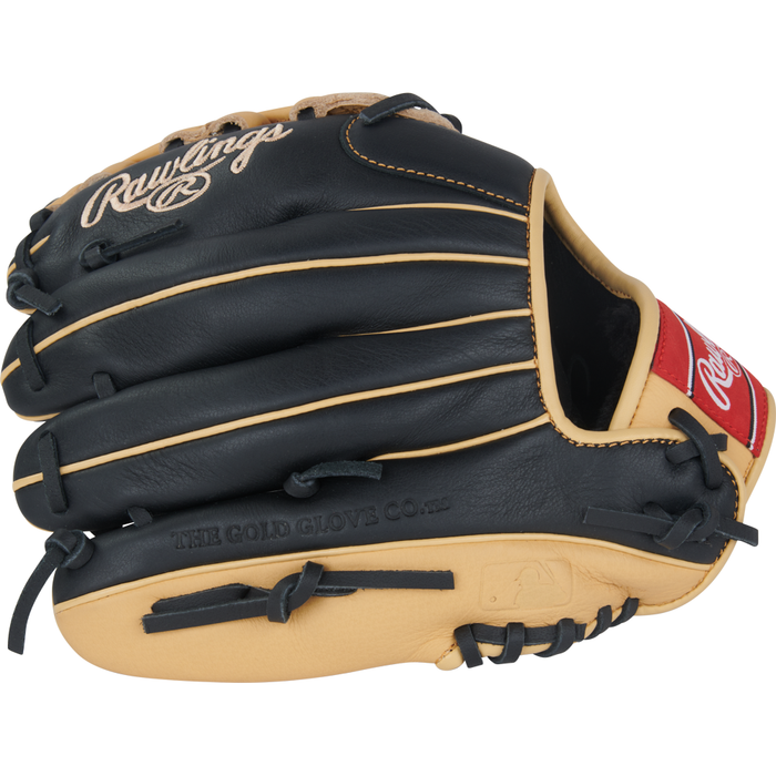 A close-up of the Rawlings Select Pro Lite 11″ Fernando Tatis Jr. Baseball Glove (model SPL110FTJ) showcases its black and tan leather construction with red accents and visible stitching. The glove features “Rawlings” and “The Gold Glove Co.” printed on it, and is inspired by the dynamic playing style of Fernando Tatis Jr.