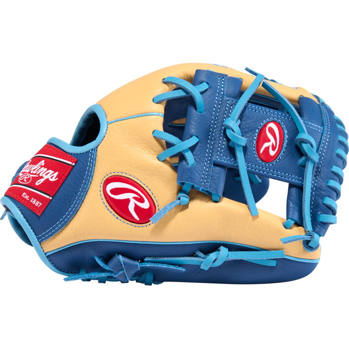A side view of the Rawlings Select Pro Lite 11.25″ Brice Turang Baseball Glove (SPL112BT) shows its tan and blue design with blue laces and red Rawlings logos on the wrist strap and thumb area. This youth infield glove is crafted by Rawlings for comfort and top-tier performance on the diamond.