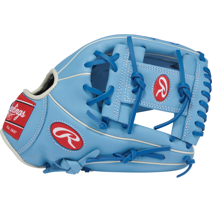 Introducing the Rawlings Select Pro Lite 11.5″ Bo Bichette Baseball Glove (SPL150BBCB)—a youth glove inspired by Bo Bichette. This light blue glove features bold blue laces, crisp white trim, and distinctive red Rawlings logos on both the thumb and wrist areas, all presented against a clean white background. Perfect for aspiring baseball players looking for quality and style from Rawlings.
