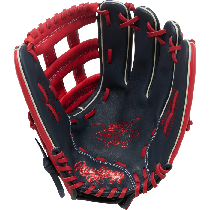 A navy blue and red Rawlings Select Pro Lite 12.25″ Mike Trout Baseball Glove (SPL1225MTNS) with red stitching and laces, featuring the Rawlings logo and Heart of the Hide branding on the palm, inspired by Mike Trout.