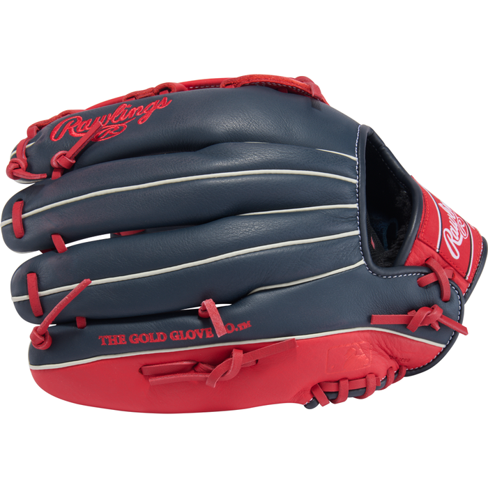 A Rawlings Select Pro Lite 12.25″ Mike Trout Baseball Glove (SPL1225MTNS) in navy blue and red, featuring red laces, white accents, and “THE GOLD GLOVE CO.” text on the side—designed as a versatile utility glove inspired by the Mike Trout youth series.