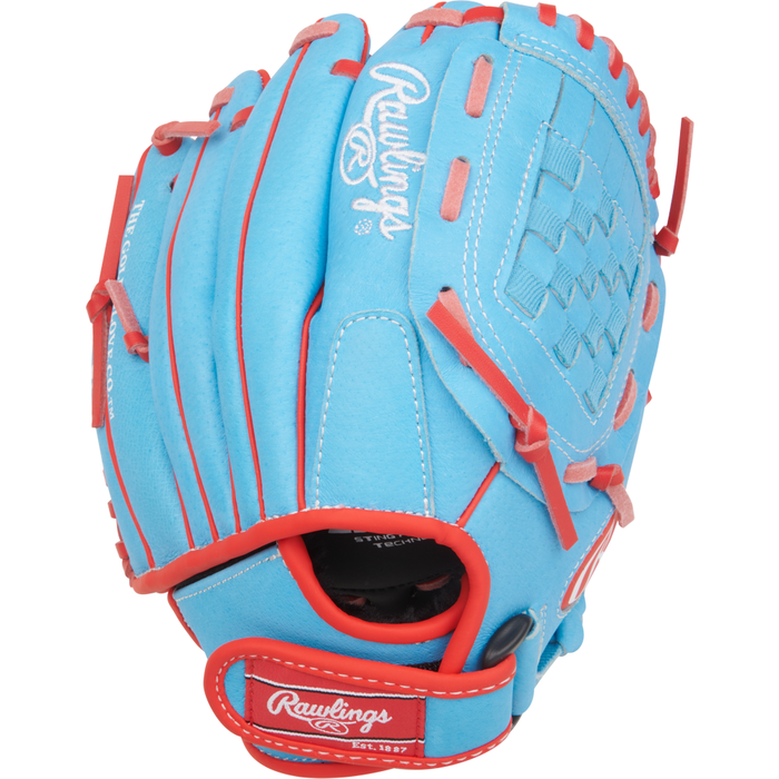 A Rawlings Sure Catch 10″ Jacob deGrom Youth Baseball Glove (SC100JDCB), designed for young players and styled after Jacob deGrom’s popular glove, featuring blue leather with red and white accents and showcasing the Rawlings logo in white on the wrist strap and thumb area.