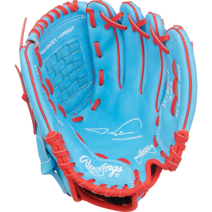 A blue and red Rawlings Sure Catch 10″ Jacob deGrom Youth Baseball Glove (model SC100JDCB) with basket webbing, featuring a white signature and logos printed inside the palm, inspired by the glove used by Jacob deGrom.