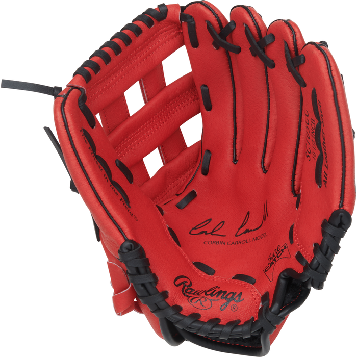 A Rawlings Sure Catch 10.5″ Corbin Carroll youth baseball glove featuring a red design with black laces and stitching. The glove is open to display the palm area, which includes printed autographs, model details, and a design inspired by Corbin Carroll.