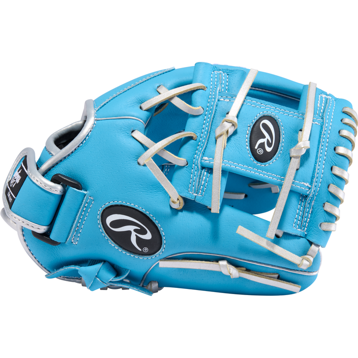 Introducing the Rawlings Sure Catch 11″ Brice Turang Youth Baseball Glove (SC110BT): a turquoise glove accented with crisp white laces and bold black Rawlings logos on the wrist strap and backhand. Designed for young players, this glove combines standout style with reliable performance on the field.