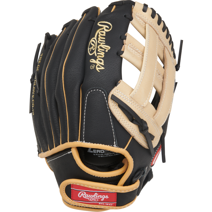 A black and tan Rawlings Sure Catch 11″ Fernando Tatis Jr. Youth Baseball Glove (SC110FTJ), featuring visible stitching, gold logos, and red Rawlings patches on the wrist strap and thumb area, is photographed against a white background.