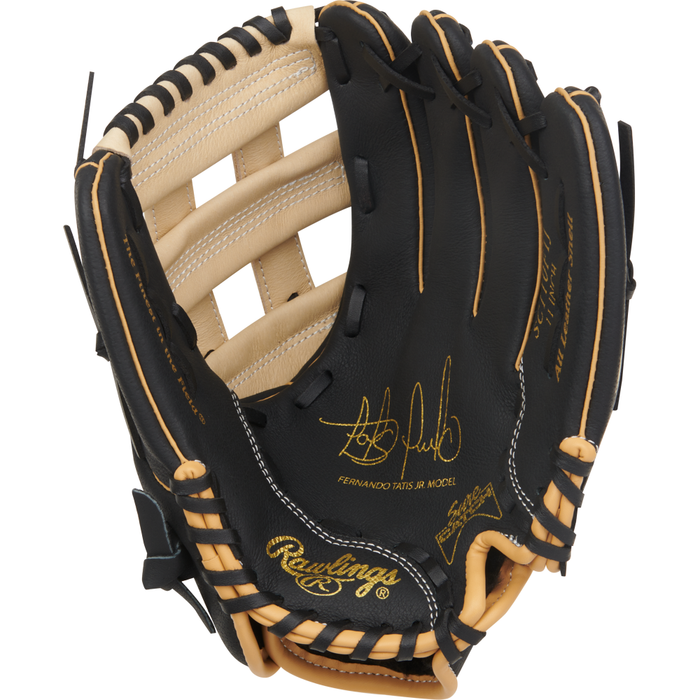 A black and tan Rawlings Sure Catch 11″ Fernando Tatis Jr. youth baseball glove, model SC110FTJ, with gold stitching, a signature and the name Fernando Tatis Jr. on the palm, and a woven webbing pattern.