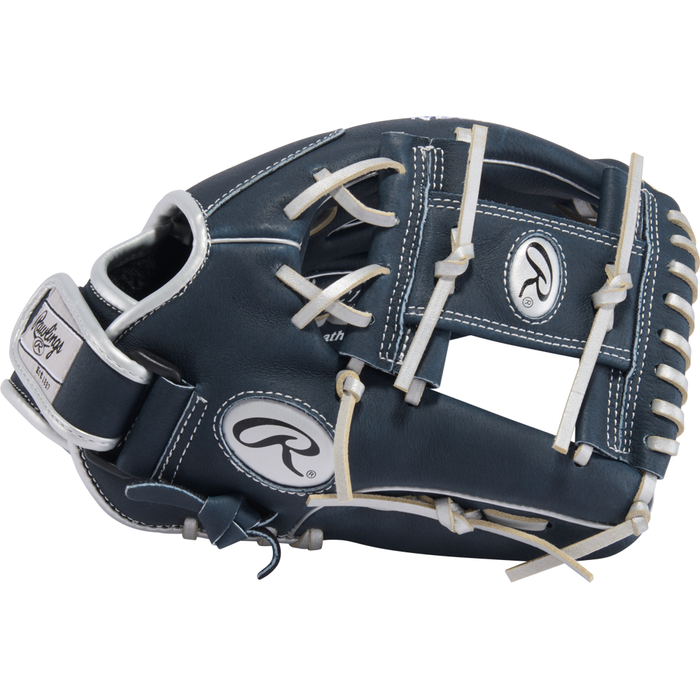 The Rawlings Sure Catch 11.5″ Anthony Volpe Youth Baseball Glove (SC115AV) features a dark blue design with white laces and stitching, along with the Rawlings logo displayed on both the wrist strap and near the thumb. Inspired by Anthony Volpe’s infield glove, this glove is perfect for young players aiming to elevate their game.