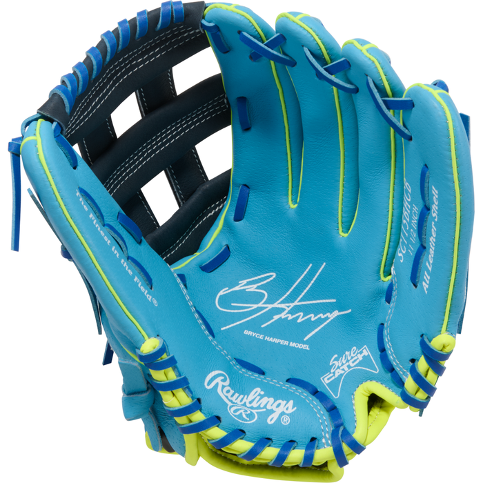 A vibrant Rawlings Sure Catch 11.5″ Bryce Harper Youth Baseball Glove (model SC115BHCB) features a striking blue design with neon yellow accents, blue laces, and white signature details on the palm. This youth infield glove showcases bold stitching, prominent Rawlings branding, and “Bryce Harper Model” written inside—making it the ideal choice for aspiring players eager to play like their favorite pro.