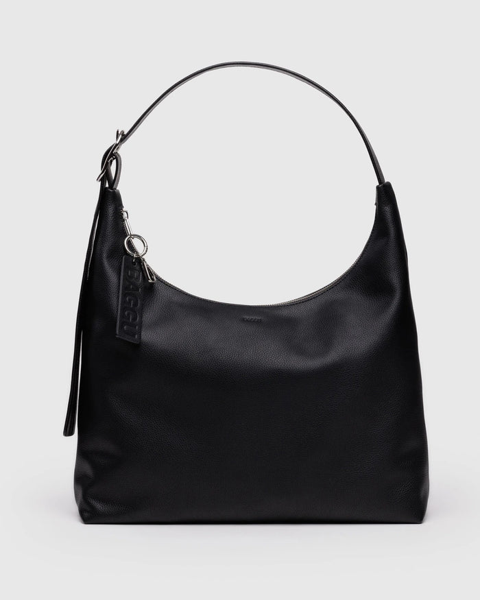 Black recycled leather shoulder bag with top handle and hanging keychain charm, front view