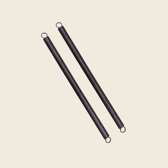 Pair of black Gratz Pilates roll down bar springs with looped ends for Cadillac units.