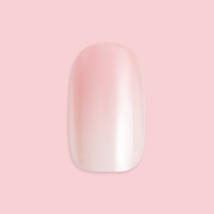 Rose Syrup Gradient - Press-On | Short | Round showing single short round false nail with rosy pink gradient polish on pale pink background