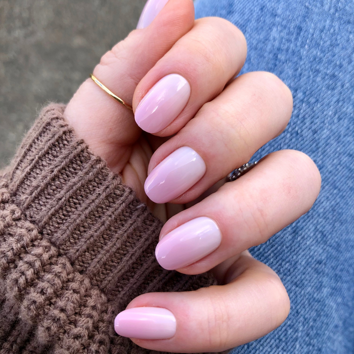 Rose Syrup Gradient - Press-On | Short | Round showing hand with short round false nails in soft pink gradient manicure
