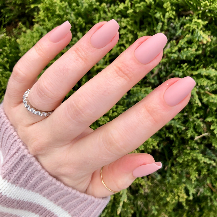 Rosewood Matte - Press-On | Medium | Coffin on hand showing soft matte rosy-brown mani outdoors with rings