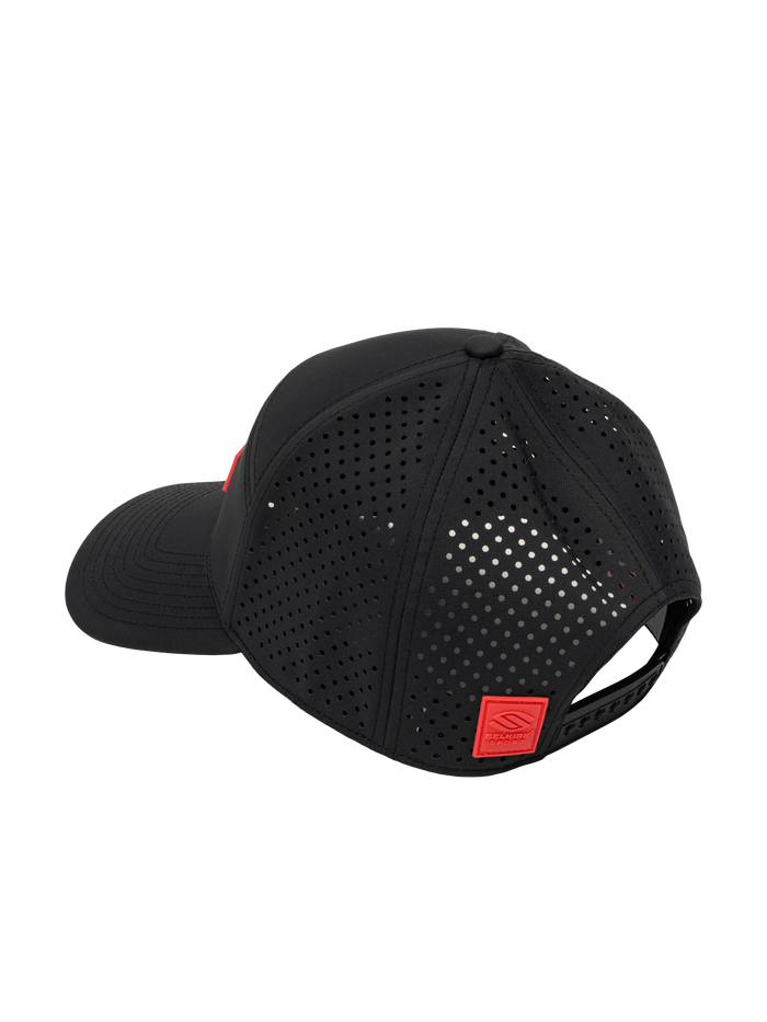 Black perforated baseball cap with adjustable snapback and red square logo patch on back.