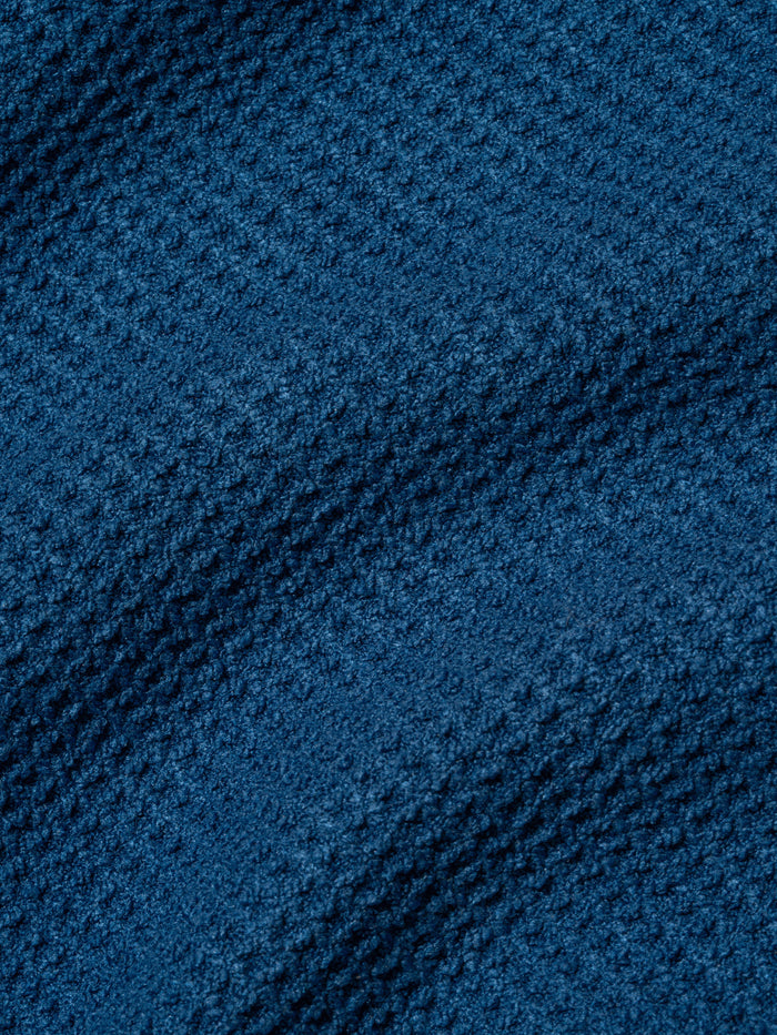 Dark blue textured boucle fabric with diagonal ribbed pattern.
