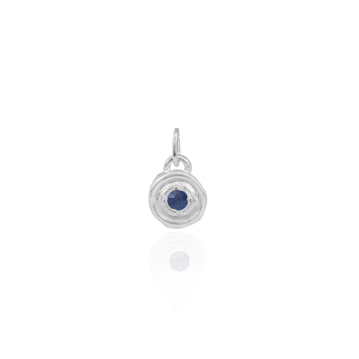 Silver pendant with a blue gemstone on a white background